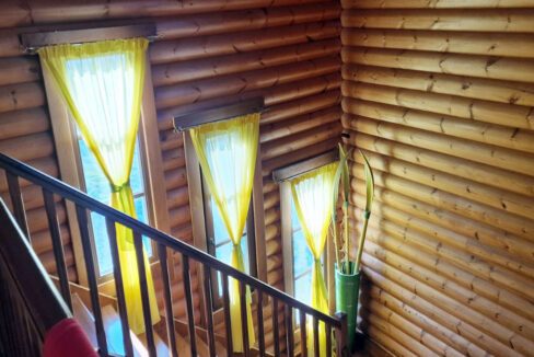 Large maisonette made of tree trunks near sea and mountain