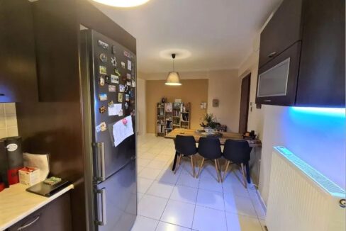 modern kitchen and kitchen table of the apartment in Patras